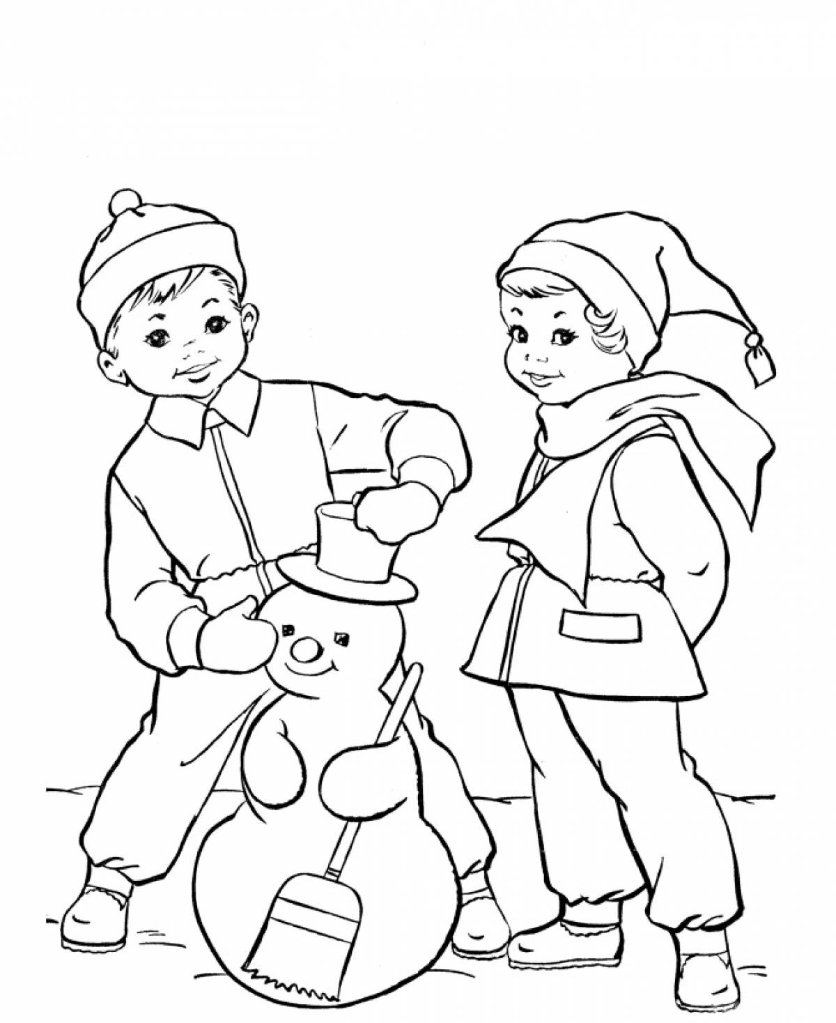 Boy and girl making a snowman
