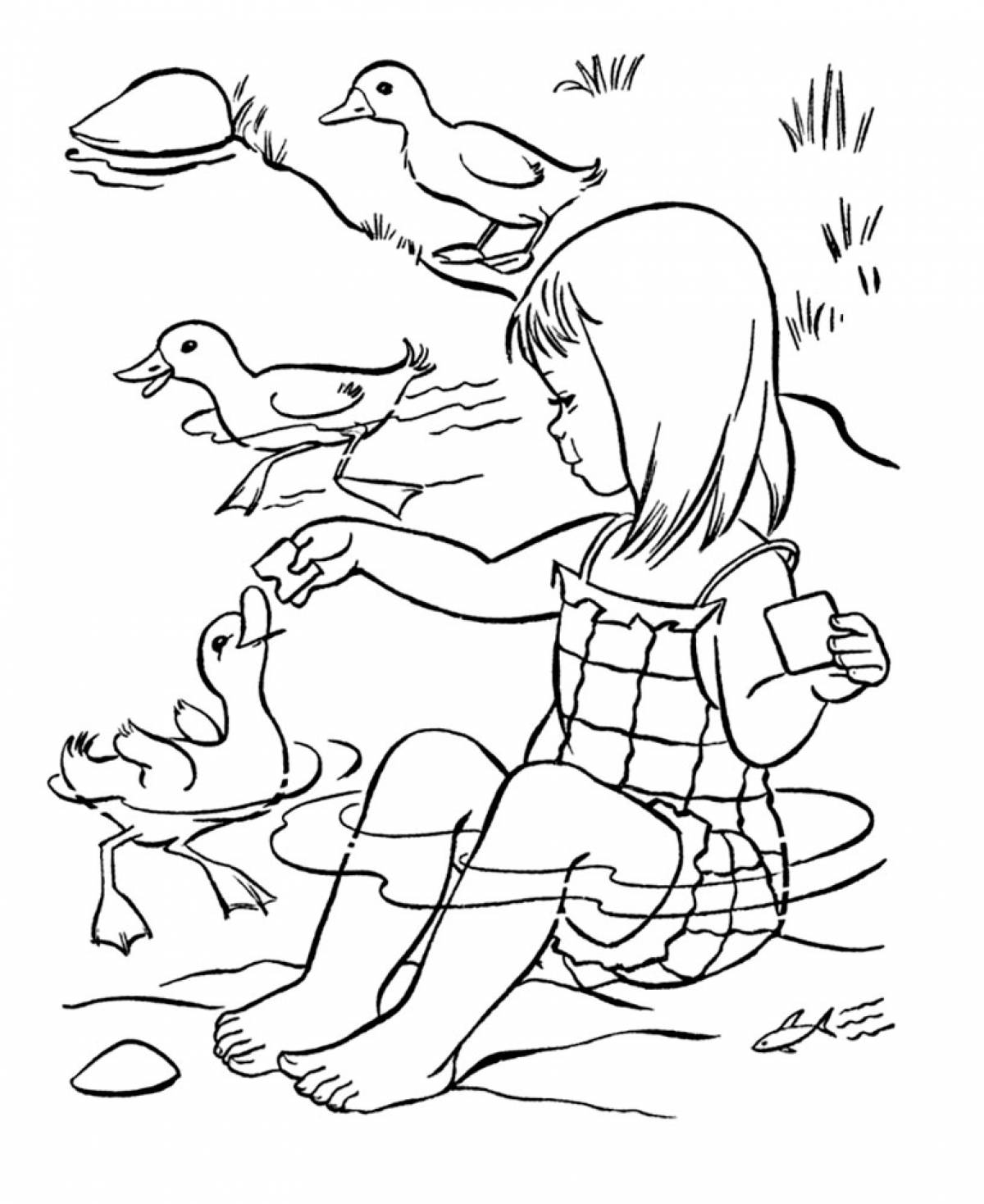 Girl feeding ducks
