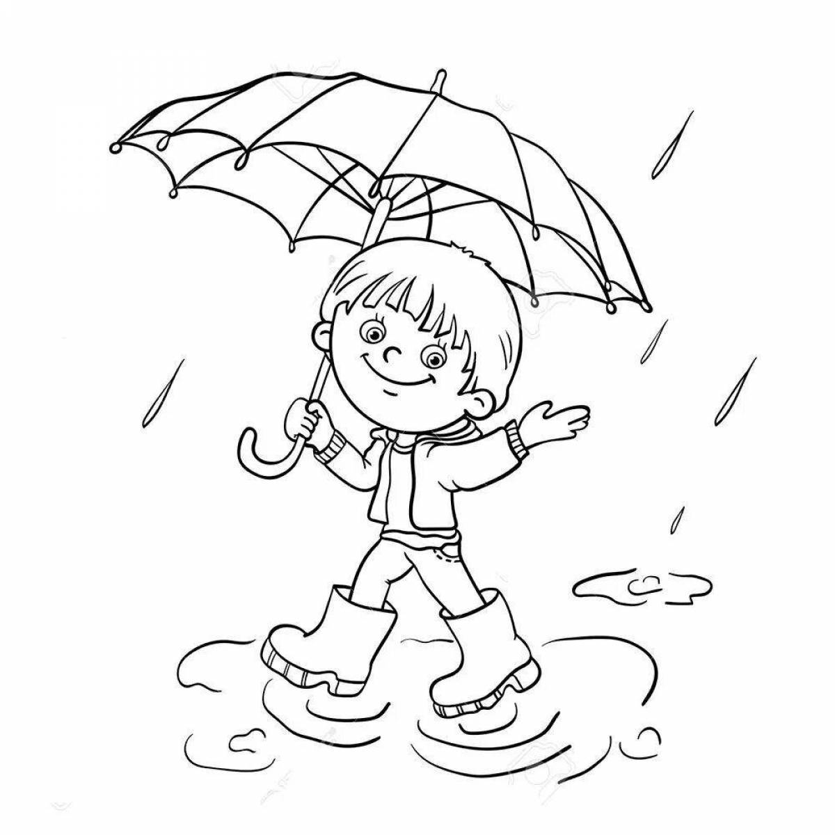 Мальчик под зонтиком под дождем