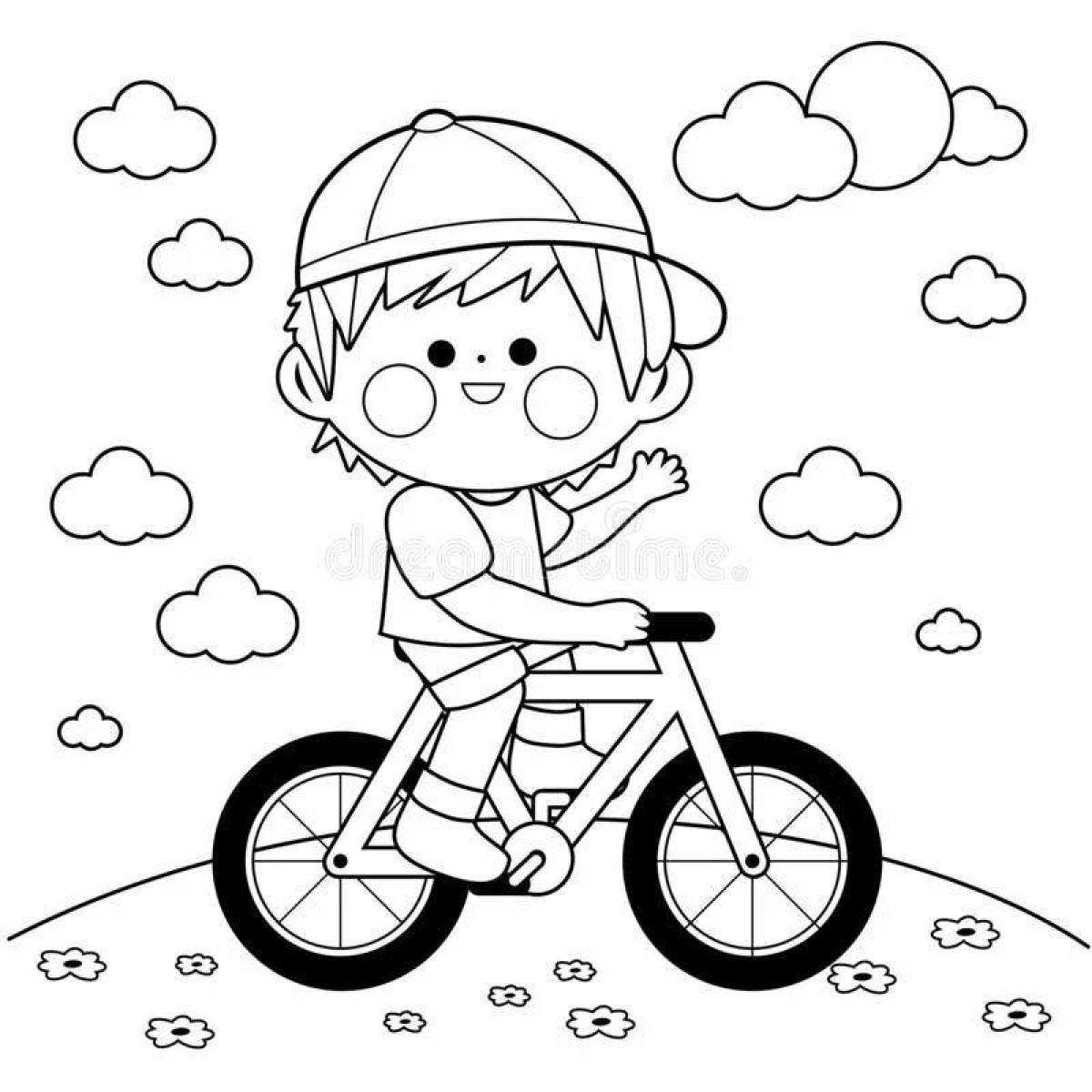 Фото Веселый мальчик на велосипеде