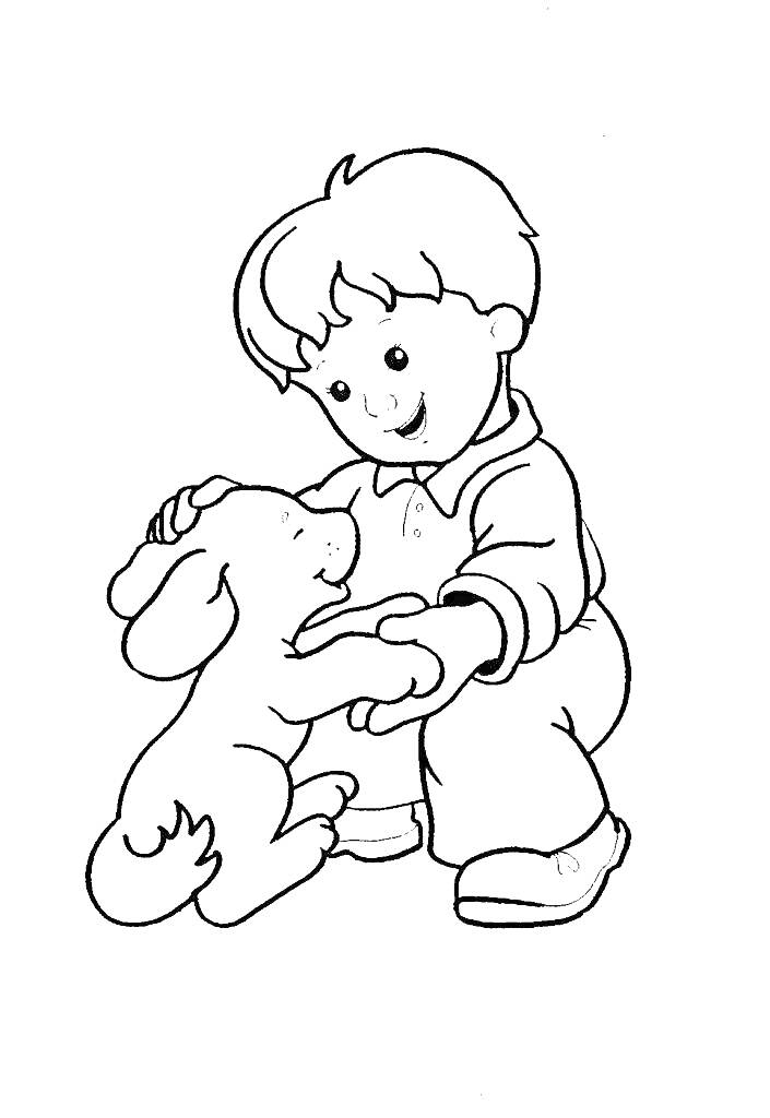 Мальчик гладит стоящего на задних лапах кролика