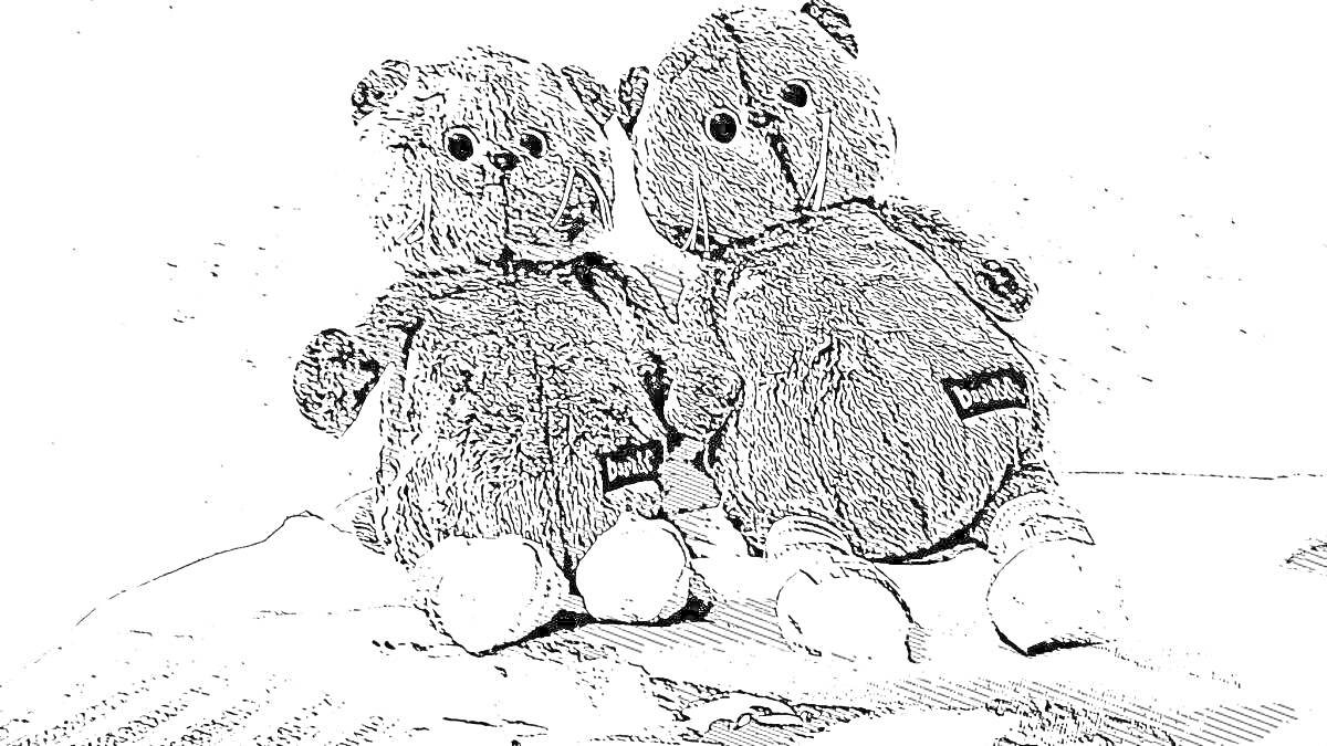 Два мягких плюшевых медвежонка на пледе
