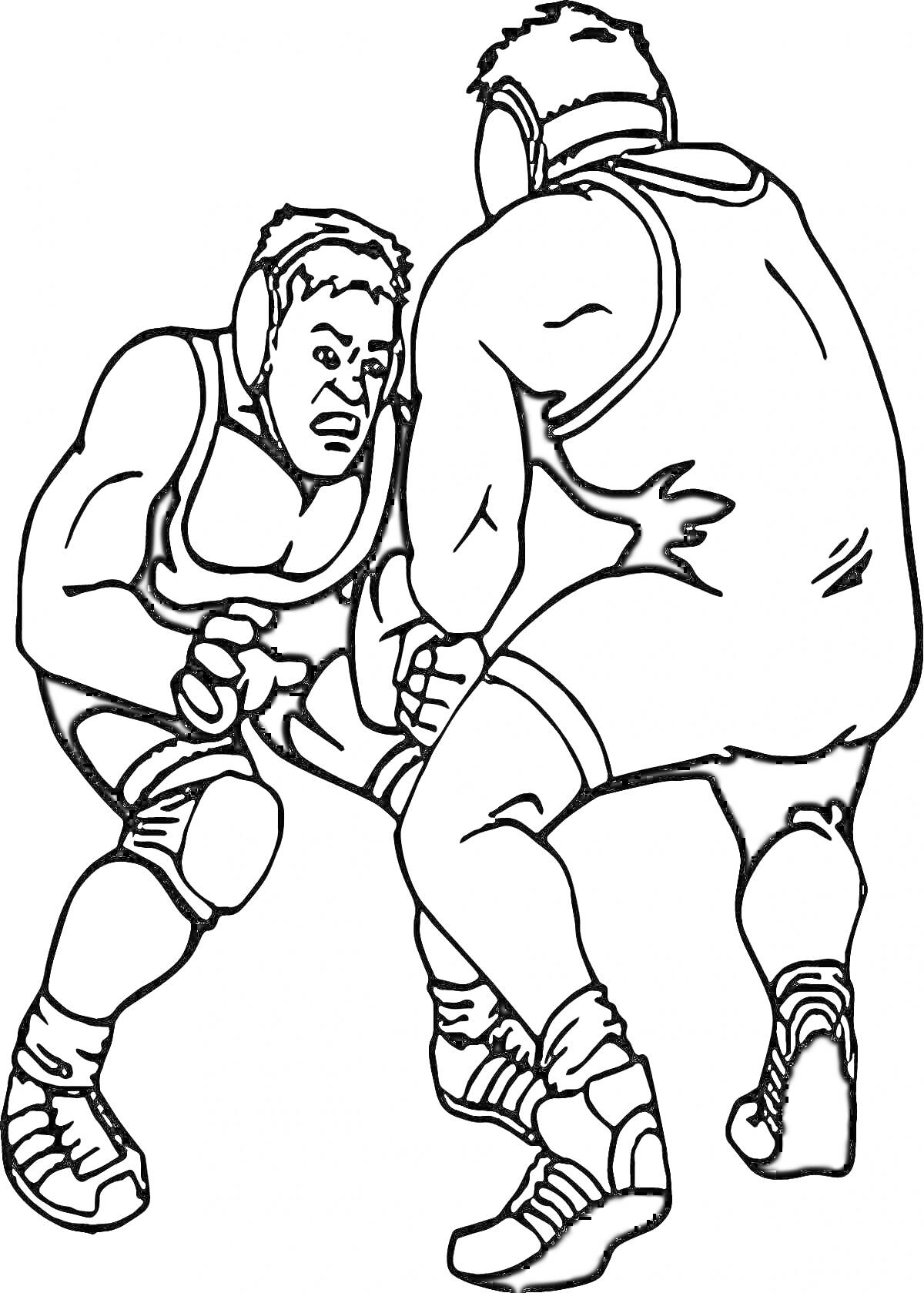 Два борца в схватке, одетые в борцовские трико и шлемы, готовятся к борьбе на ковре