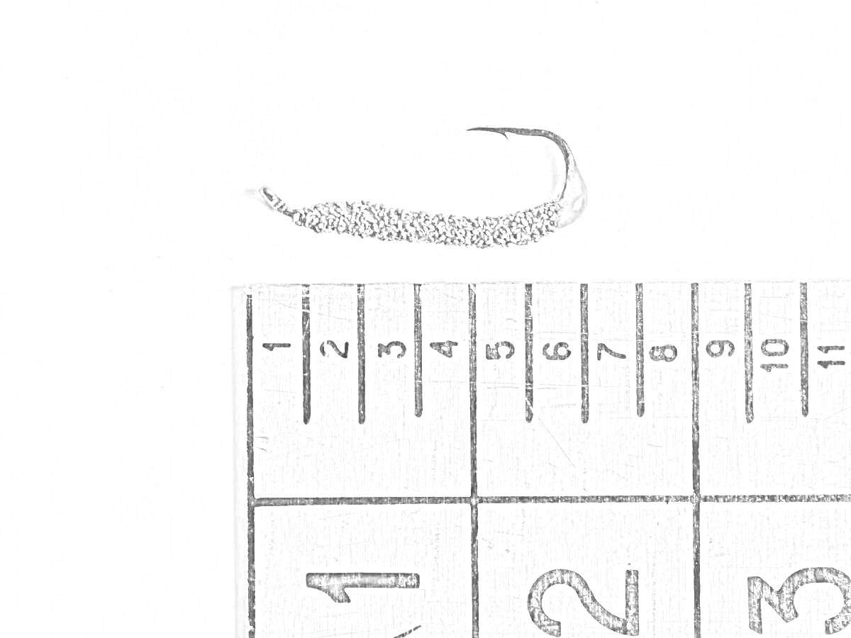 Мормышка с крючком в масштабе рядом с линейкой (0-5 см, 0-2 дюйма)